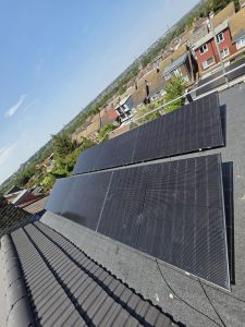 Clean flat-roof solar panel installation on a residential outbuilding in Ilford, London
